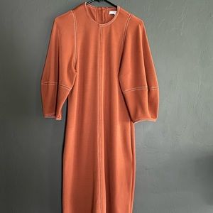 Tibi in a burnt orange color. This is the longer midi length! GORGEOUS!
